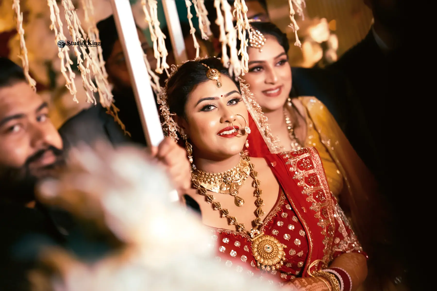 Witness the graceful entrance of the bride as she steps into her new journey. Studio Kings Best Wedding Photographer in Chandigarh captures the elegance and anticipation that surrounds this special moment.
