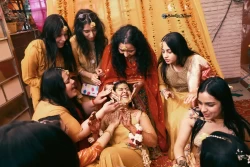 Capture the golden moments of togetherness during the family's Haldi celebration. Studio Kings Wedding Photography highlights the love and laughter that make this occasion memorable.