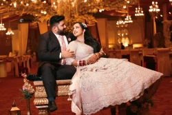 Experience a sunset serenade of love in this evening portrait. Studio Kings Photography bathes the couple in the warm, romantic glow of the setting sun.