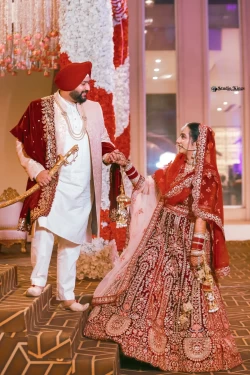 Share in the celebration of love as the couple makes their joyful entry. Studio Kings Photography captures the genuine smiles and happiness in this special moment.