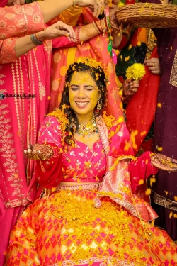 Dive into the playful tradition of Haldi ceremony with its joyful splashes. Studio Kings Wedding Photography captures the laughter and cultural richness of this vibrant ritual.
