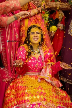 Follow the bride's colorful path to radiance through the Haldi ritual. Studio Kings Wedding Photography highlights the beauty and cultural significance of this ceremony.