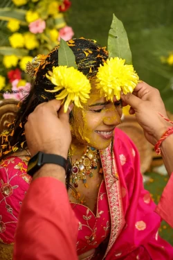 Experience the joyful journey of Haldi paste traditions in a bride's life. Studio Kings Wedding Photography captures the smiles and traditions that mark this special occasion.