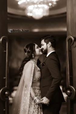 Experience the serenity of love in the golden hour of a sunset portrait. Studio Kings Photography captures the tranquil and romantic moments between the couple.